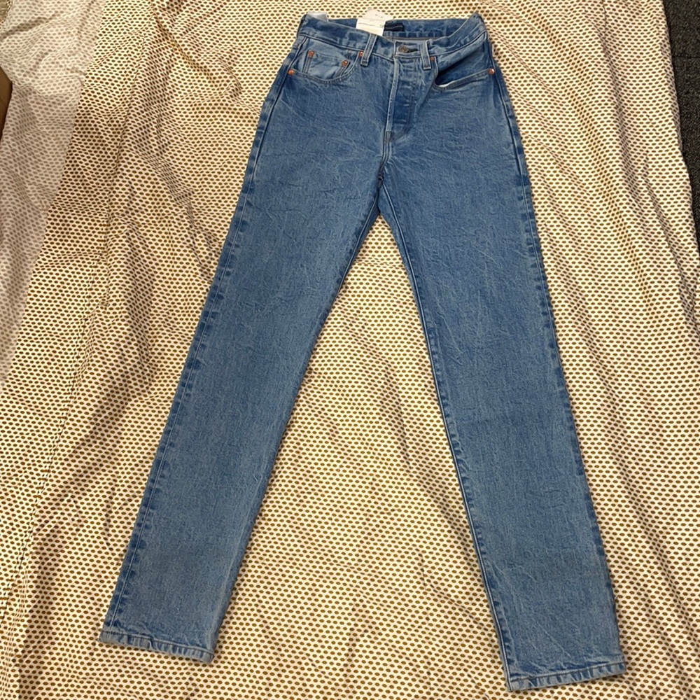Levi’s 501 original blue back label. High rise, button fly, straight leg.